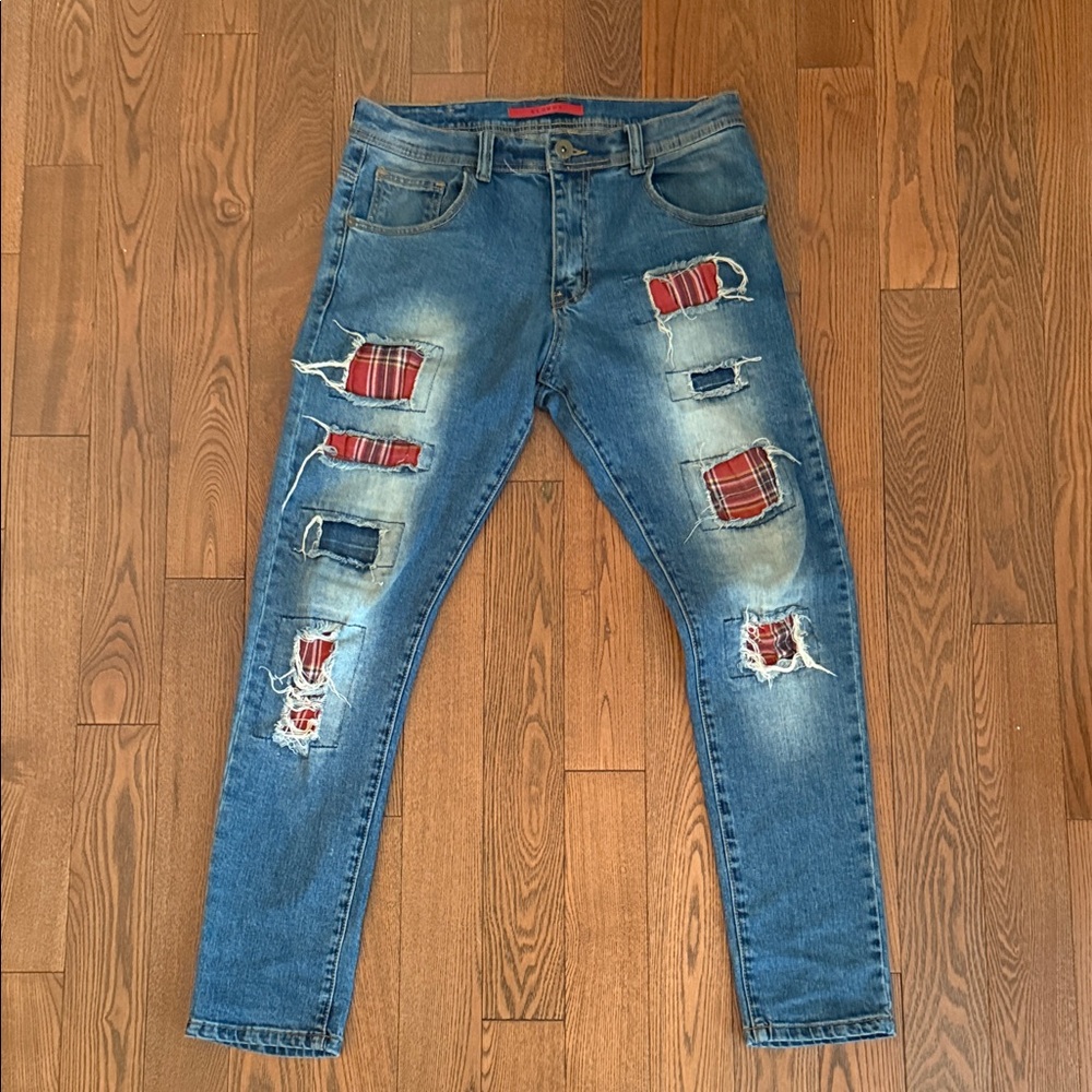 Trendy Blue Distressed Jeans with Red Plaid Accents